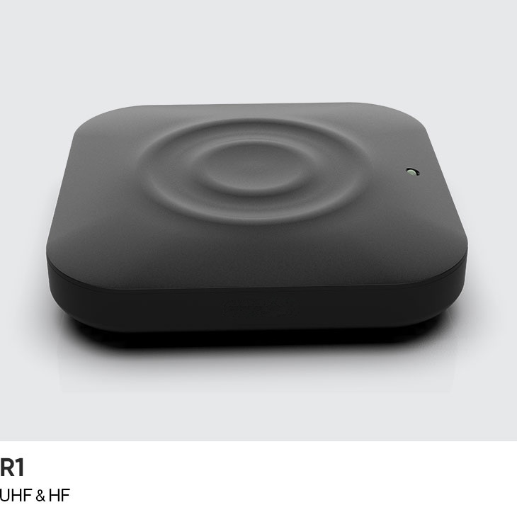 CedaGlo R1 desktop RFID reader seen from above, concentric rings molded into the top face