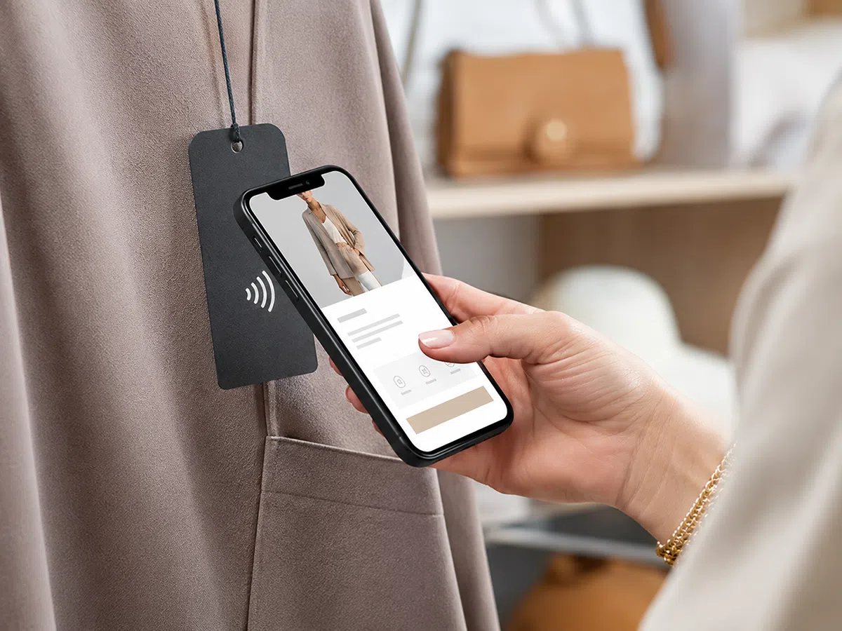NFC apparel hang tag for smartphone brand interaction and digital product passport