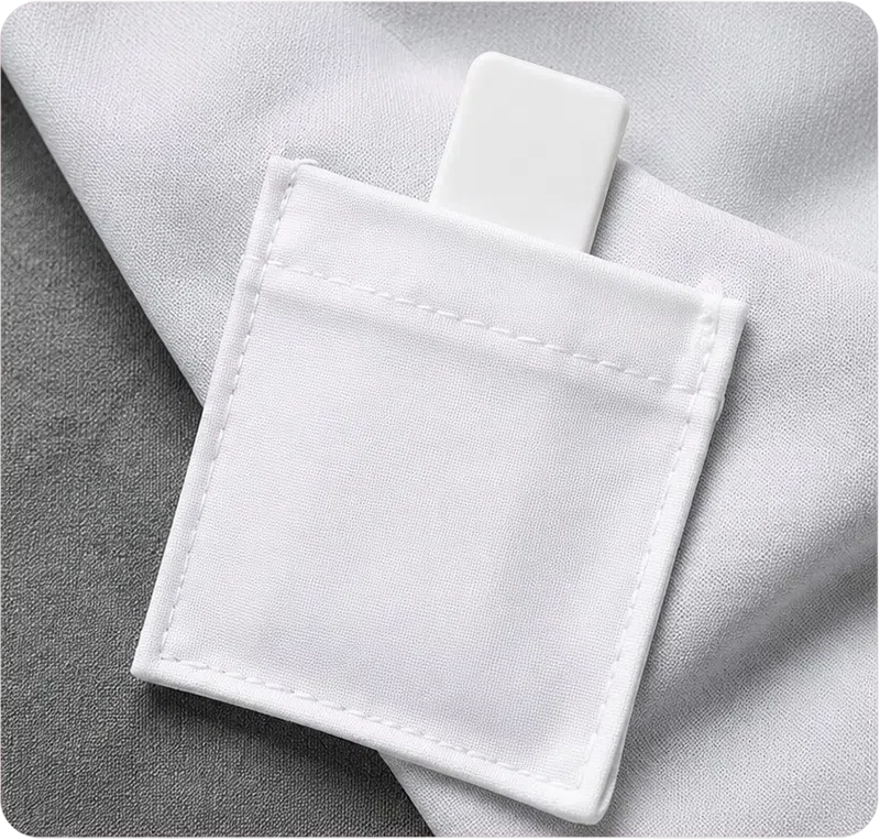 Silicone RFID laundry tag placed inside fabric pouch for installation