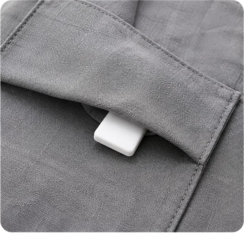 Hidden silicone RFID laundry tag embedded within textile layers