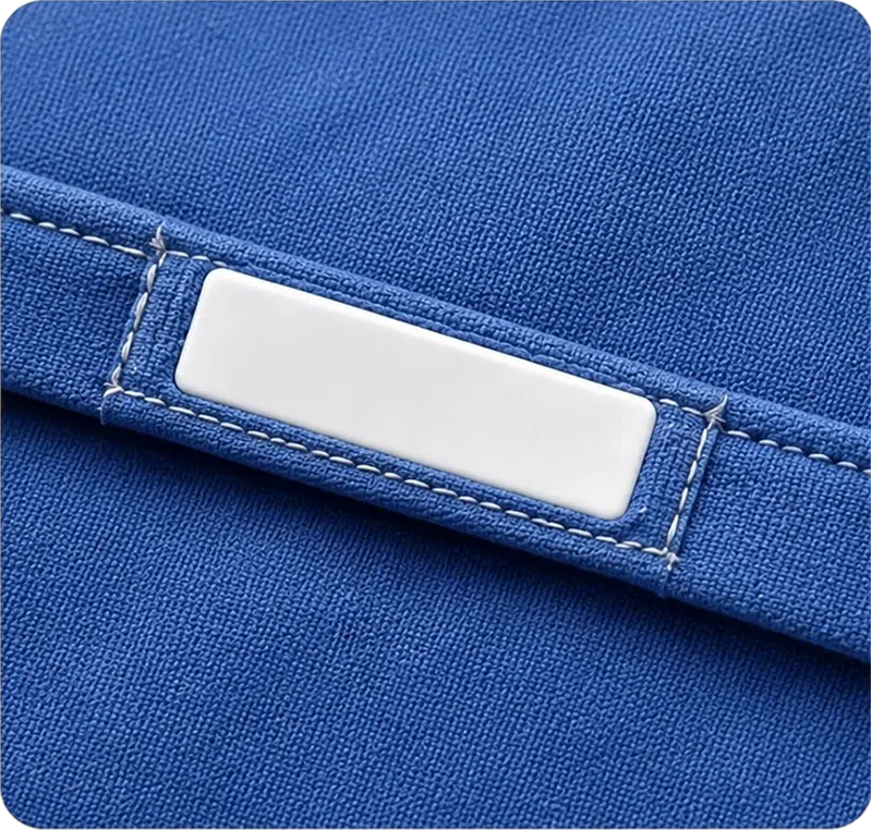 Silicone RFID laundry tag sewn into seam or hem for textile tracking